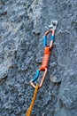 A quickdraw carabiner attached to a rock cliff Royalty Free Stock Photo