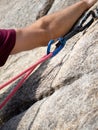 Quickdraw for rock climbing and rope resting on the wall securing climber from the fall Royalty Free Stock Photo