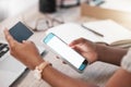 The quickest way to get the bills paid. an unrecognisable businesswoman using a smartphone and credit card at her desk Royalty Free Stock Photo