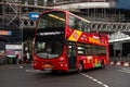 Quickly driving Hop-on Hop-off red Volvo bus on a City Sightseeing Tour under the North Bridge in Edinburgh with a motion blur Royalty Free Stock Photo