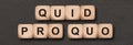 Quid pro quo written on wooden cube