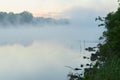 Quiet calm early morning on lake in summer. Magic dawn with fog. Concept of seasons,ecology, environment, natural Royalty Free Stock Photo