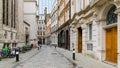 Quiet City of London street Austin Friars with bollards and doorways