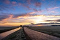 Quiet colorful sunrise with orange and pink sky during the winter in Giethoorn, the Netherlands