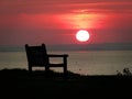 Quiet contemplation sunset beach bench