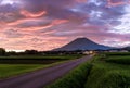 Quiet country road leads to Mt. Daisen and dramatic sunrise clouds