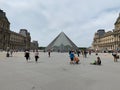 Quiet day near The Louvre Pyramid, Paris, a large glass and metal structure