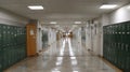 Quiet Hallway in a School Campus Featuring Lockers on Both Sides and an Open Central Space Royalty Free Stock Photo