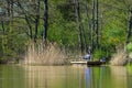 Quiet lake and fisherman