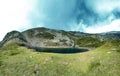 Quiet lake on the peak of mountains