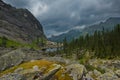 A quiet lake among rocks and dense taiga Royalty Free Stock Photo