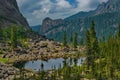 A quiet lake among rocks and dense taiga Royalty Free Stock Photo