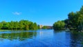 Tranquil lake view, houses in the distance are faintly visible