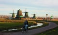 Quiet local Dutch cyclist pedaling peacefully among the zaandam paved paths