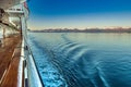 Dawn light on mountains and cruise ship Port side ocean ripples, Alaska, USA. Royalty Free Stock Photo