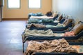 quiet nap area with small cots and blankets, undisturbed