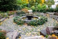 Quiet nook with a small fountain in the garden of the Church of the Annunciation that in Petrovsky Park, Moscow, Russia. Royalty Free Stock Photo