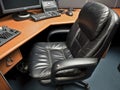 Empty office chair with computer and accessories