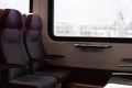 Quiet and peaceful train compartment with vacant seats offers a perfect setting for reflection. Soft lighting highlights the Royalty Free Stock Photo