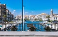 Quiet and peaceful view of typical fisher boats and colorful houses from the bridge