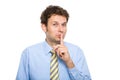 Quiet please, finger on his lips, isolated Royalty Free Stock Photo