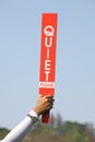 The quiet please sign was held up by volunteer in golf tournament. Royalty Free Stock Photo