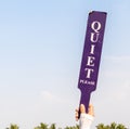 The quiet please sign was shown by staff in golf tournament for Royalty Free Stock Photo