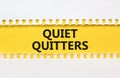 Quiet quitters symbol. Concept words Quiet quitters on yellow and white paper. Beautiful yellow and white background. Business and