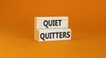 Quiet quitters symbol. Concept words Quiet quitters on wooden blocks. Beautiful orange table orange background. Business and quiet