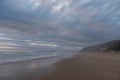 Quiet sandy beach at Brenton on Sea, Knysna, photographed at sundown, South Africa. Royalty Free Stock Photo