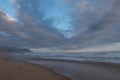 Quiet sandy beach at Brenton on Sea, Knysna, photographed at sundown, South Africa. Royalty Free Stock Photo