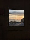 Ferry crossing and Seattle waterfront framed by window.