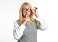 Mature woman in glasses shows a gesture of silence. Royalty Free Stock Photo