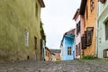 Quiet street, leaving the Fortress Square in the castle of old city. Sighisoara ÃÂity in Romania Royalty Free Stock Photo