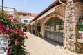 Quiet street with stone buildings with large glass windows and stone pavement in Zikhron Yaakov city in northern Israel