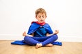 Quiet superhero child breathing with zen yoga, mindfulness for strength