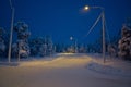 A quiet town road in the middle of winter in Lapland.