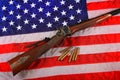 Quigley Rifle on American Flag Royalty Free Stock Photo