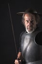 Quijote. Old bearded warrior with breastplate and helmet Royalty Free Stock Photo