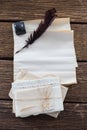 Quill feather, ink bottle, and legal documents arranged on table Royalty Free Stock Photo