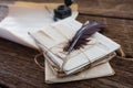 Quill feather with legal documents arranged on table Royalty Free Stock Photo