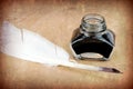 Quill pen and ink bottle Royalty Free Stock Photo