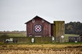 Quilt barn in Delavan, Wisconsin with cement wall and silo Royalty Free Stock Photo