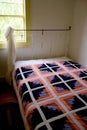 Quilt on Bed in Traditional Historic American Homestead Royalty Free Stock Photo