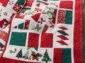A Quilted Christmas Quilt With A Red And Green Quilt. Generative AI