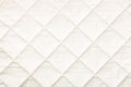 Quilted fabric background. texture blanket or puffer jacket