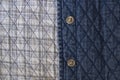 Quilted fabric denim cloth element texture close up with metal buttons Royalty Free Stock Photo