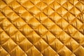 quilted satin tablecloth in gold, close snapshot