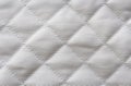 Quilted white cotton fabric texture