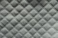 Quilted white fabric with diamond pattern from above